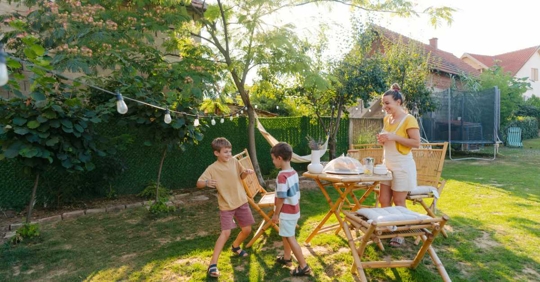 small family having fun in the backyard
